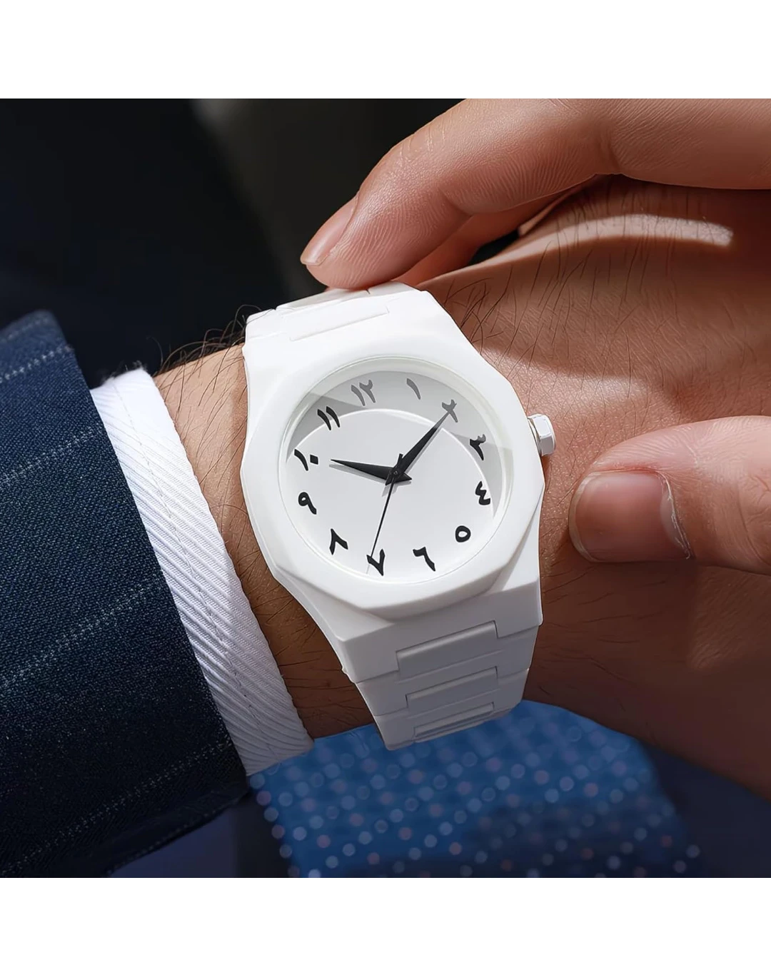 White analog wrist watch with black Arabic numerals and matching white linked strap