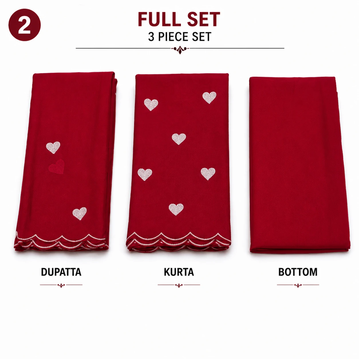 Folded red saree fabric set with white heart motifs and scalloped embroidered border