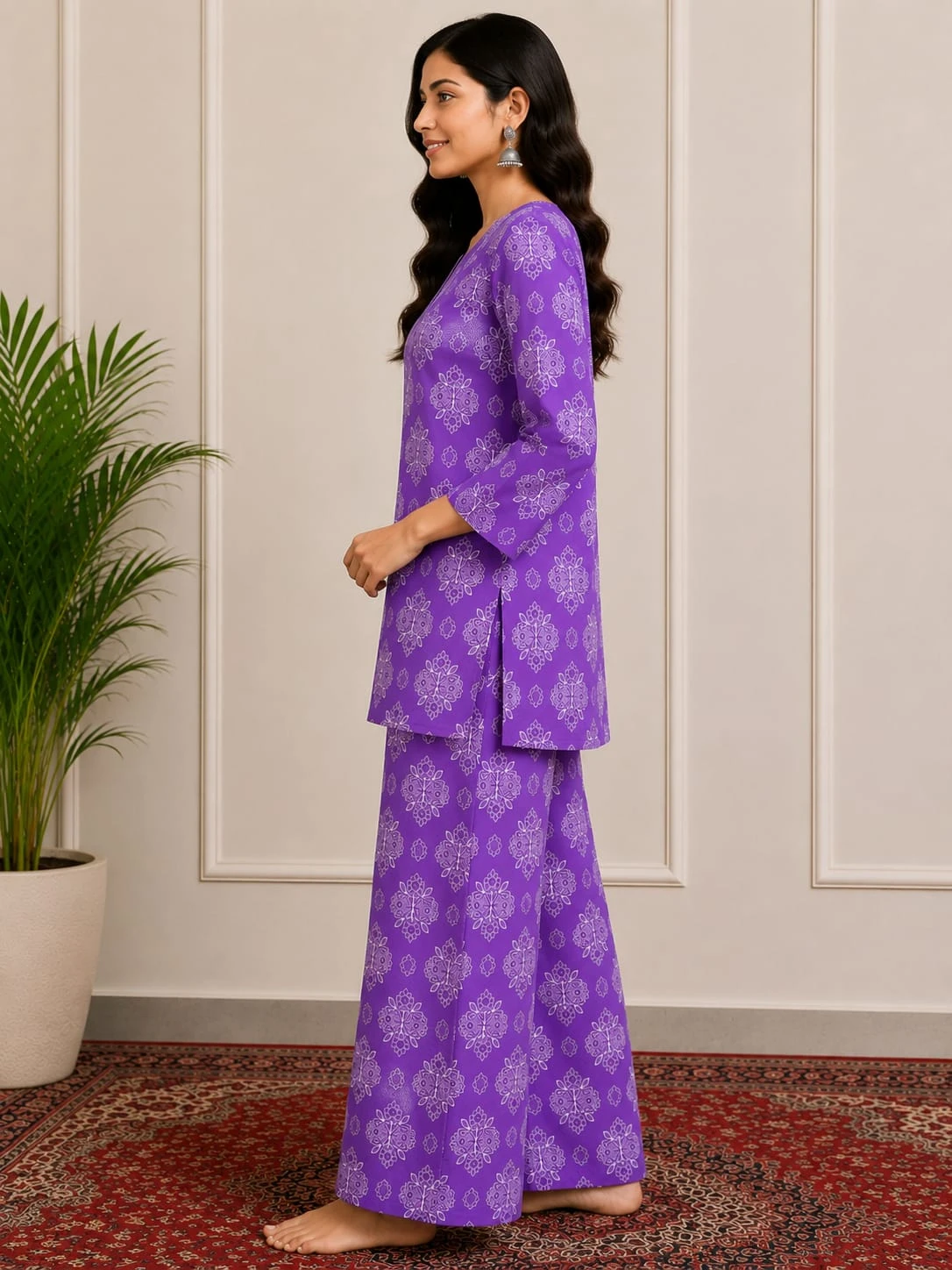 Woman wearing a purple printed kurta with three-quarter sleeves and matching wide-leg palazzo pants