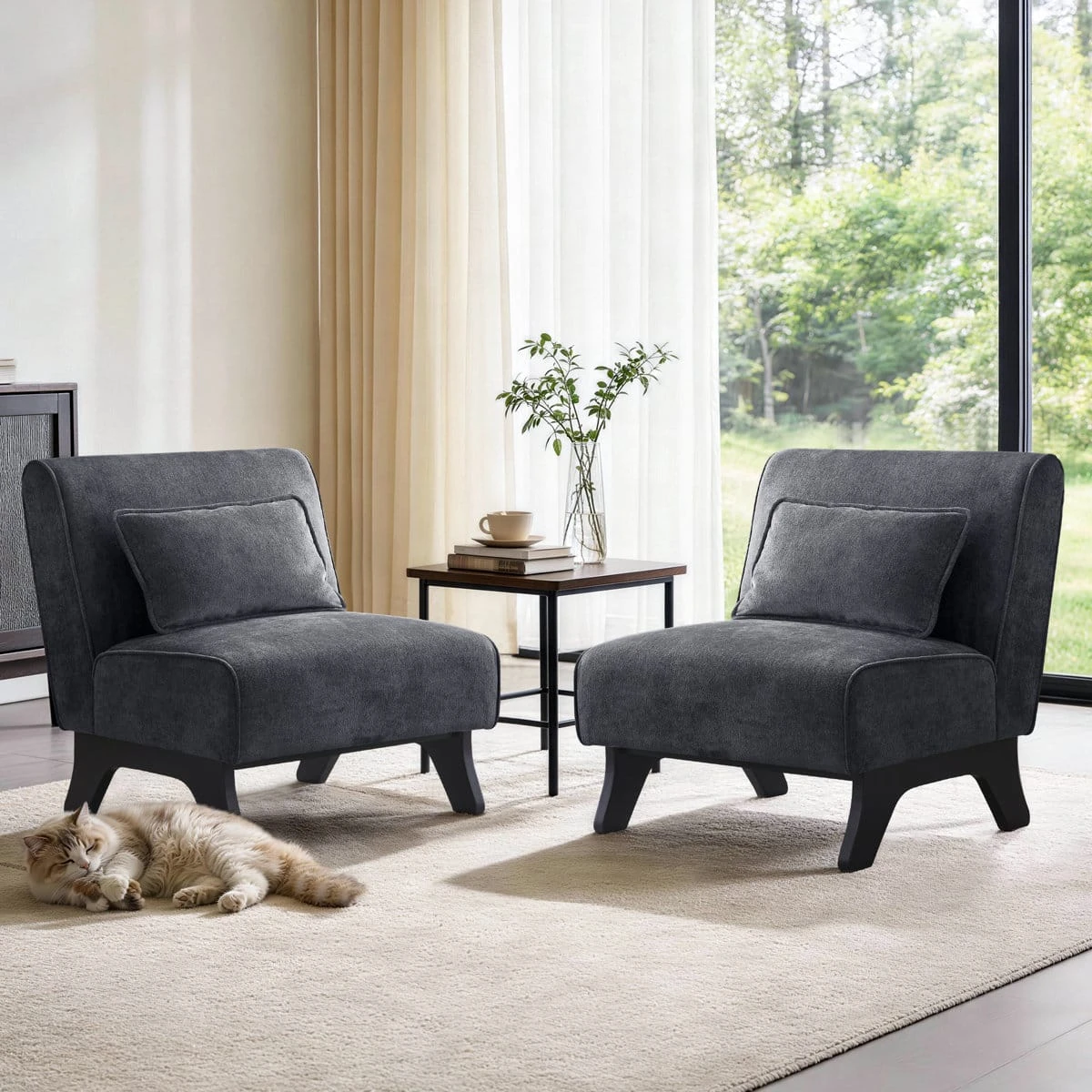 Two matching dark grey armless chairs displayed beside a small table on a light rug