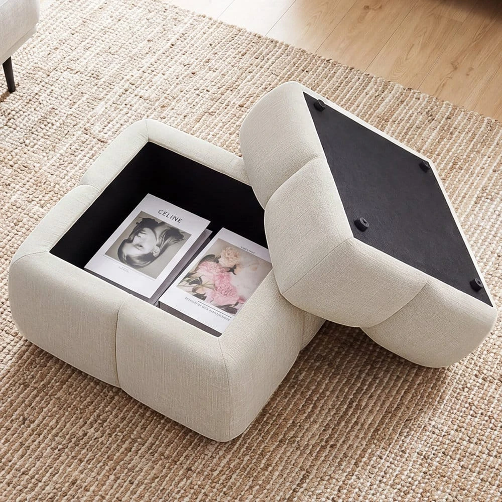 Top-down view of the ottoman opened to reveal black-lined storage space and removable lid