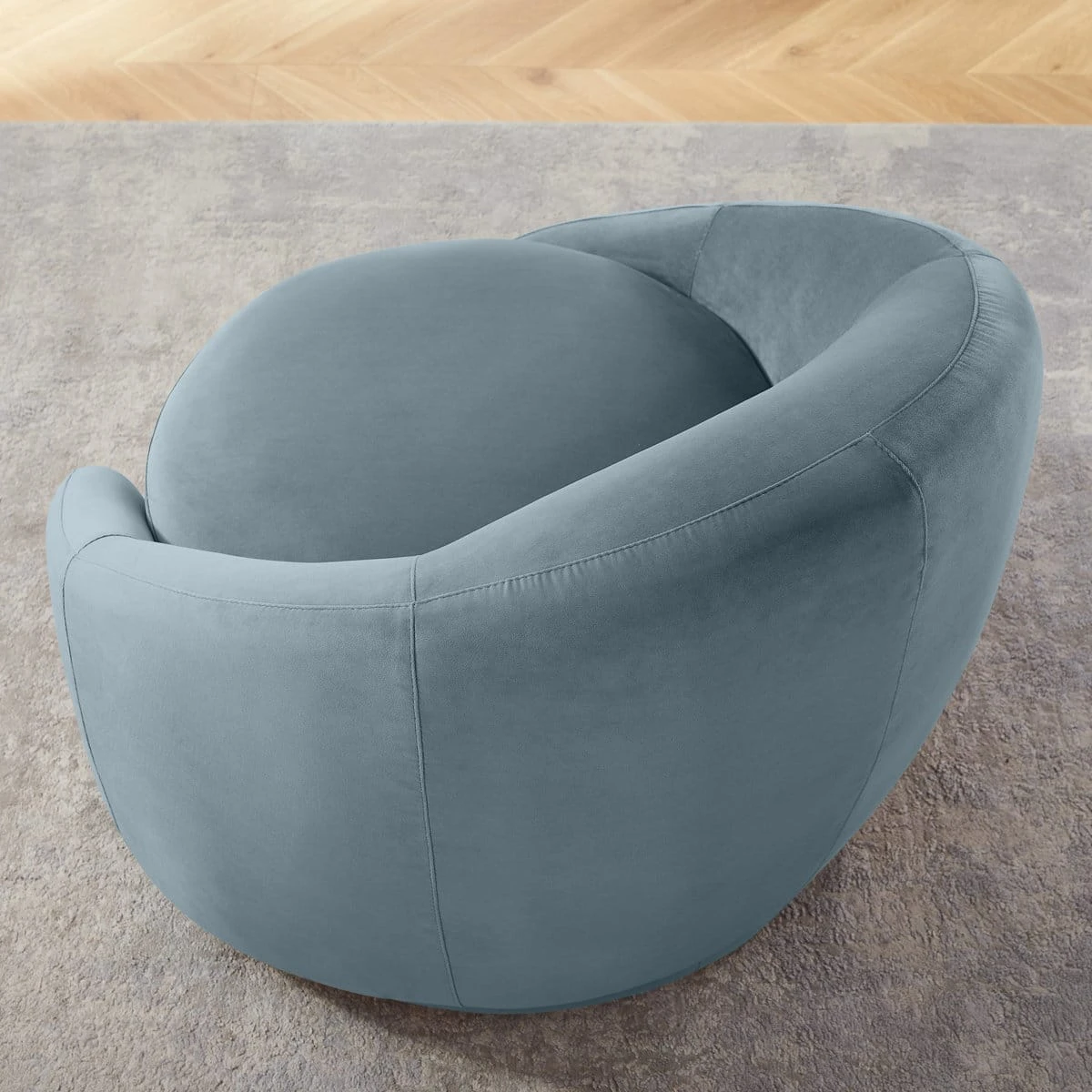 Top rear view highlighting the rounded back, curved arms and deep circular seat