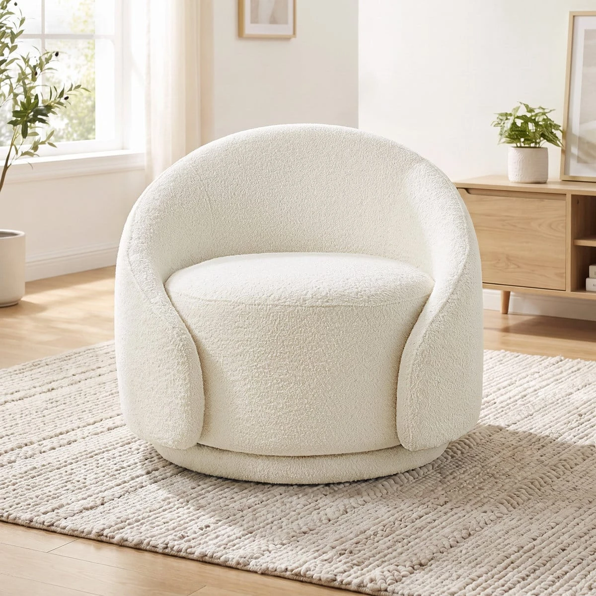 Front view of the rounded boucle chair showing the curved arms and circular base