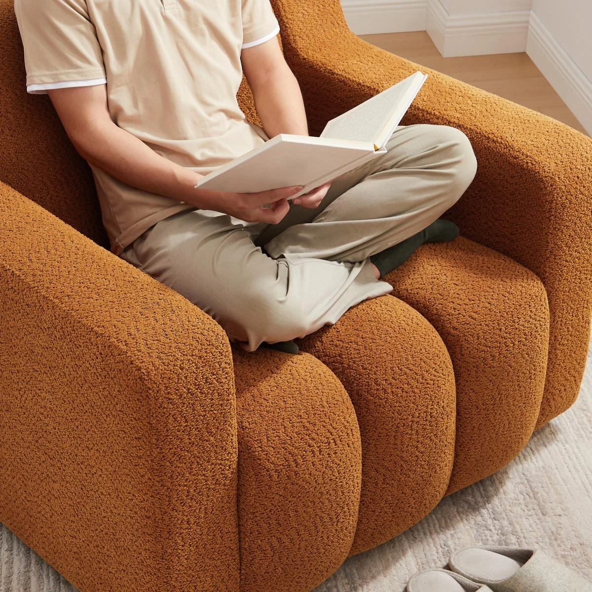 Orange 40 inch boucle fabric upholstered accent chair with channel back and wooden legs