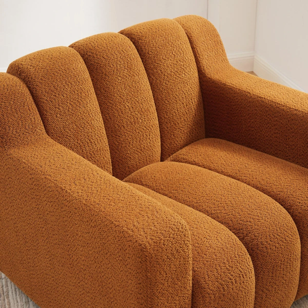 Orange 40 inch boucle fabric upholstered accent chair with channel back and wooden legs