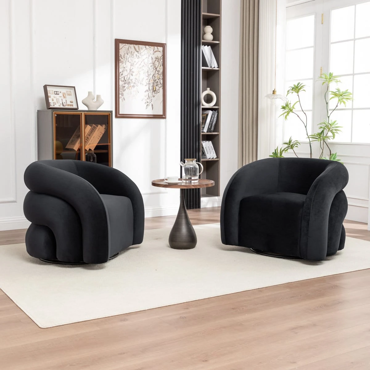 Side-angled view highlighting the curved sculptural arm and plush black upholstery of the swivel chair