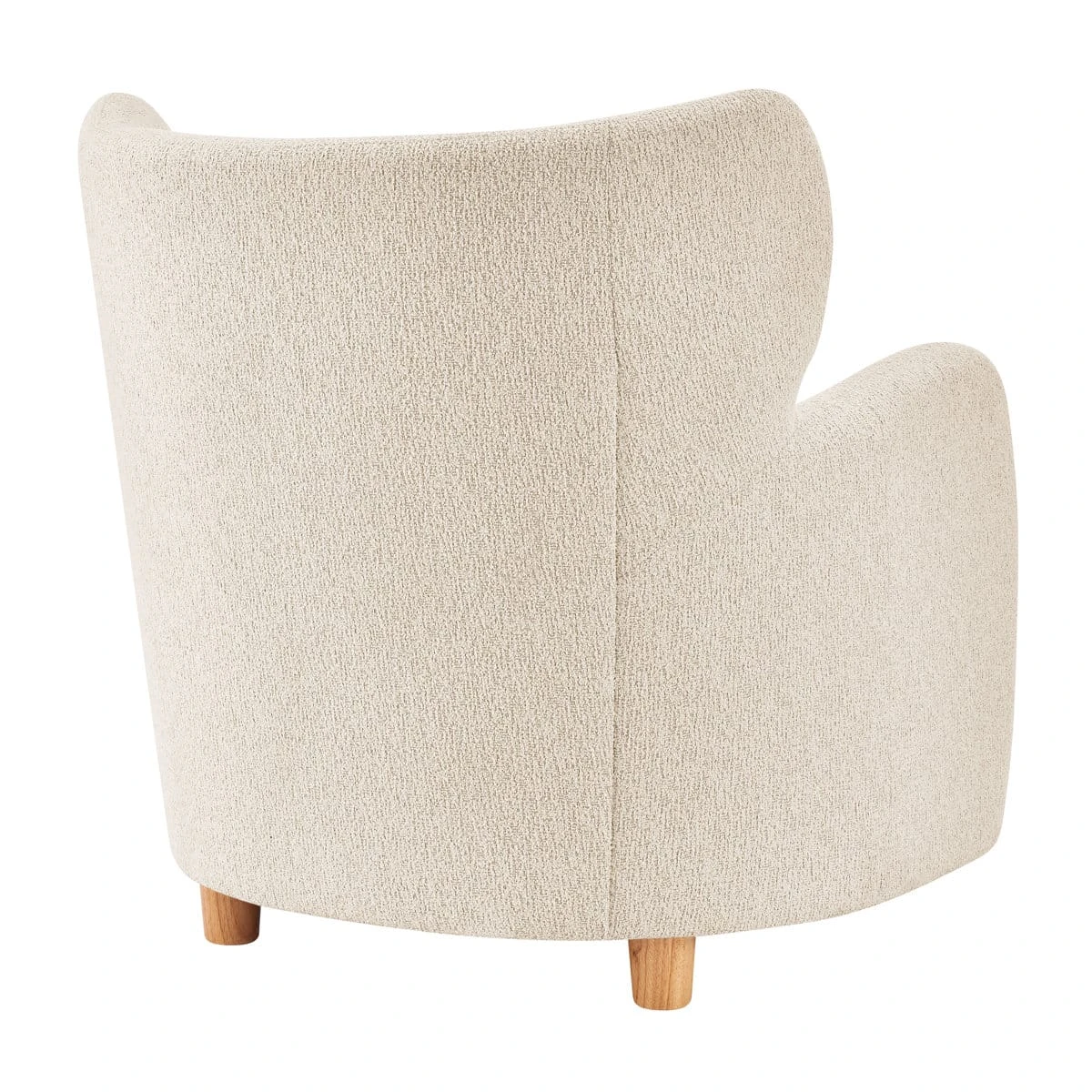 Rear view of cream boucle armchair with curved back seam and two visible short wooden legs