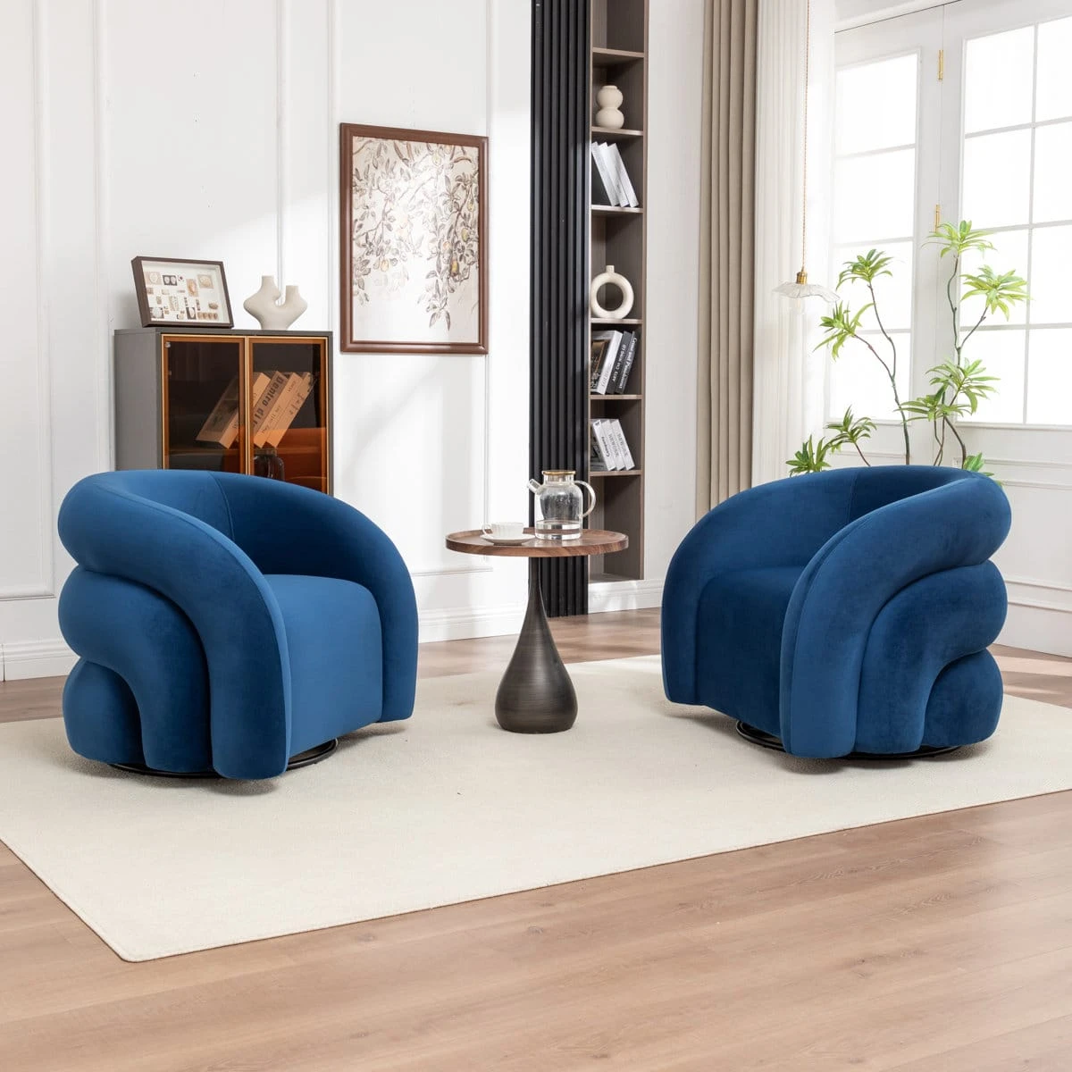 Side-front view showing the sculpted layered curves and plush blue velvet upholstery