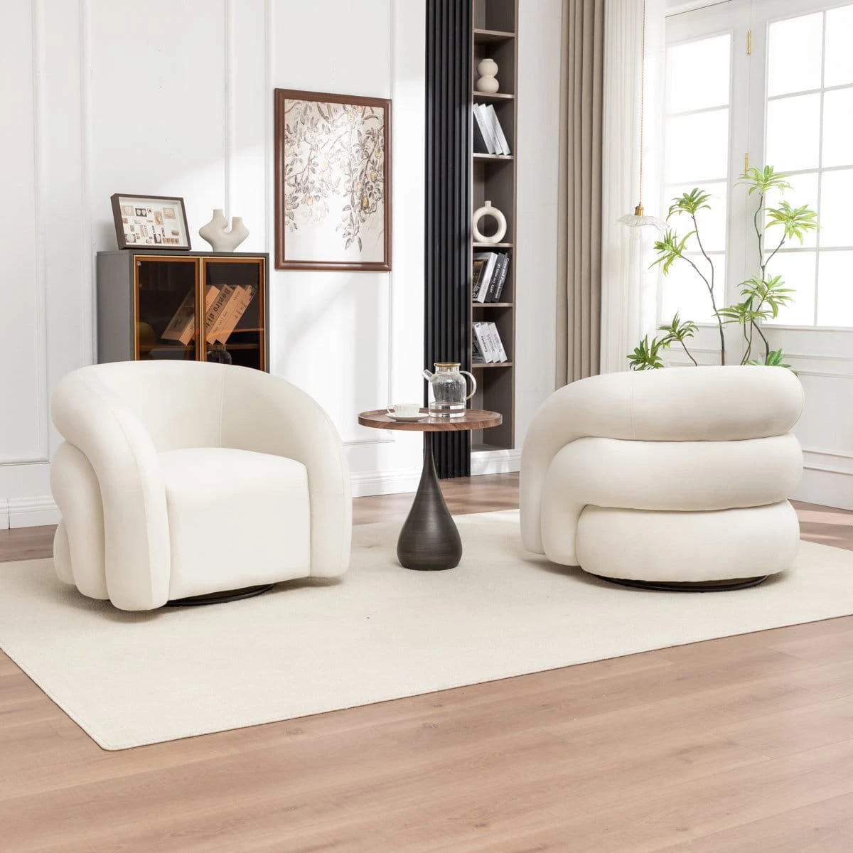 Same rounded swivel chair shown in ivory upholstery with front and rear views beside a pedestal side table