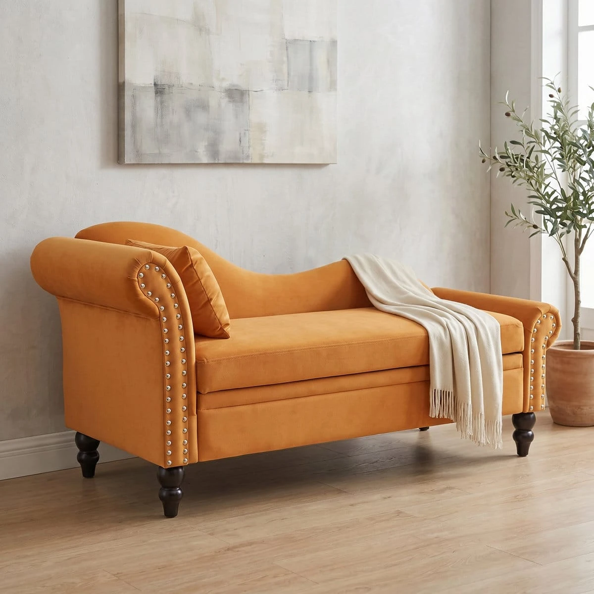 Angled room view with throw draped over the mustard chaise storage bench and matching accent pillow