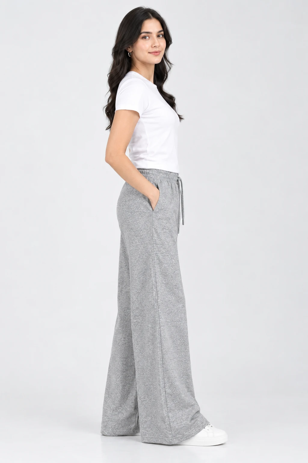 Side profile of heather grey wide-leg lounge pants with long drape, drawstring waist and pocket