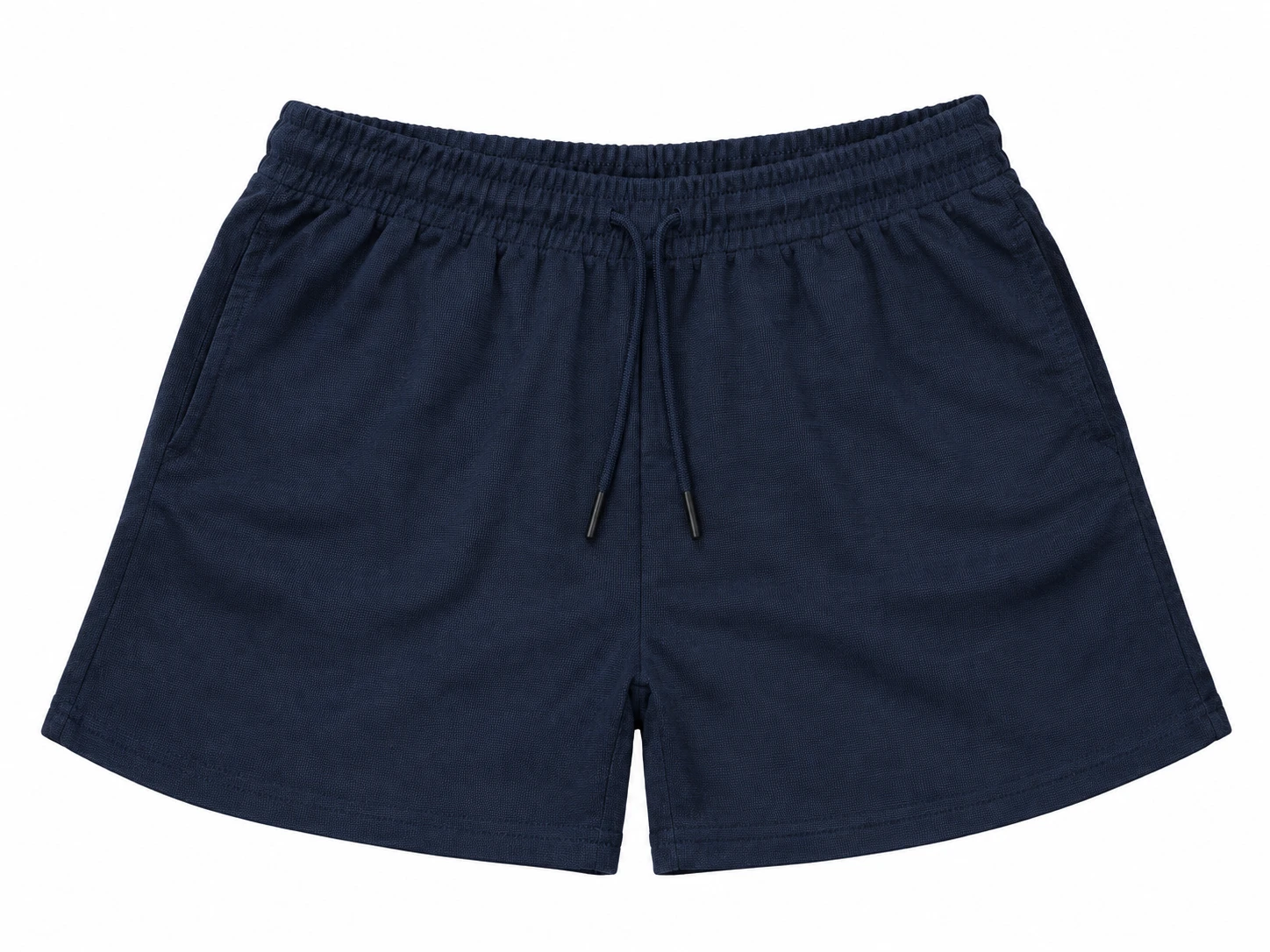 Flat lay of navy shorts, highlighting textured fabric, center drawstring, and angled side pockets