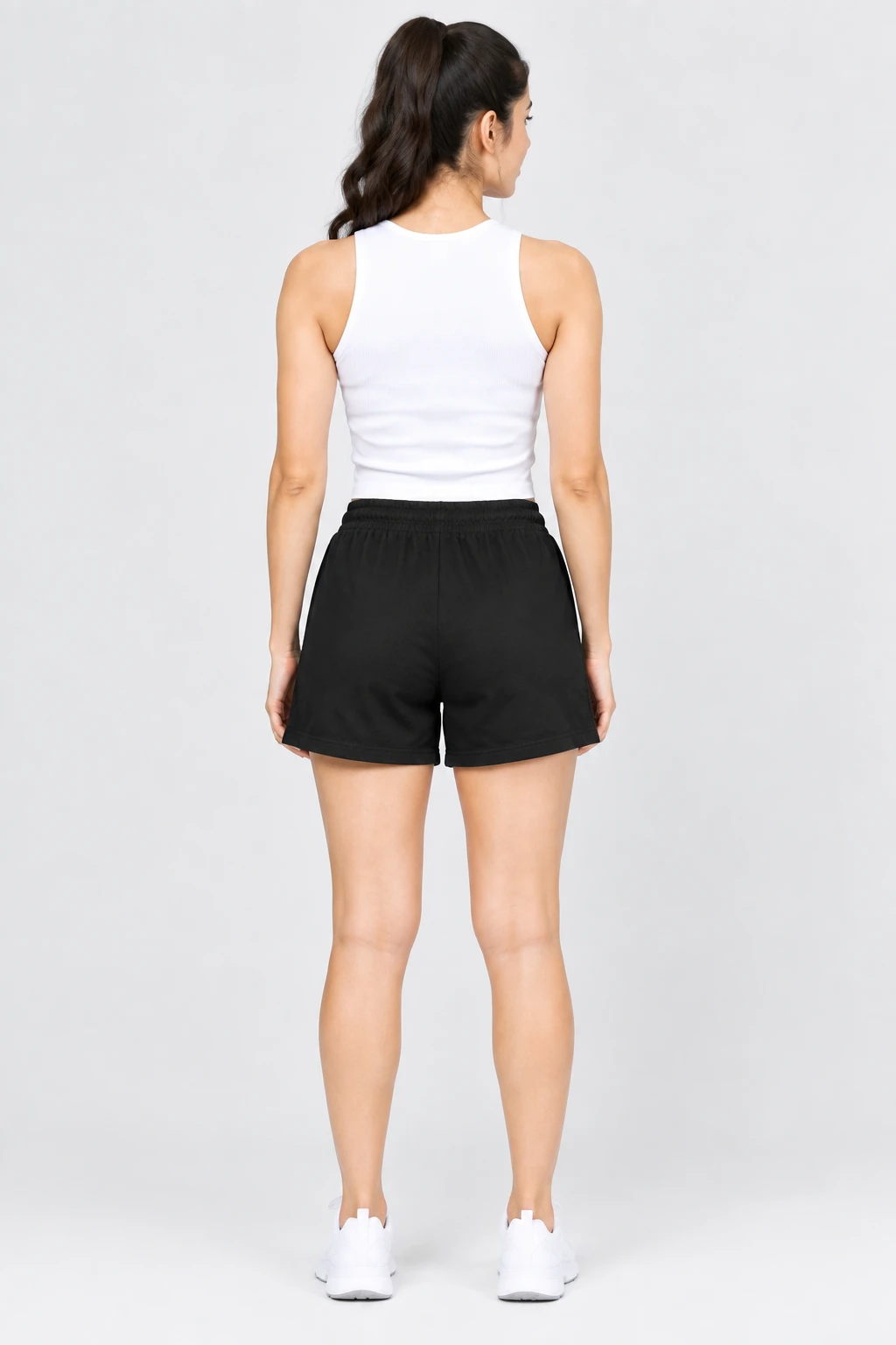 Back view of black shorts showing the elastic waistband and relaxed leg shape