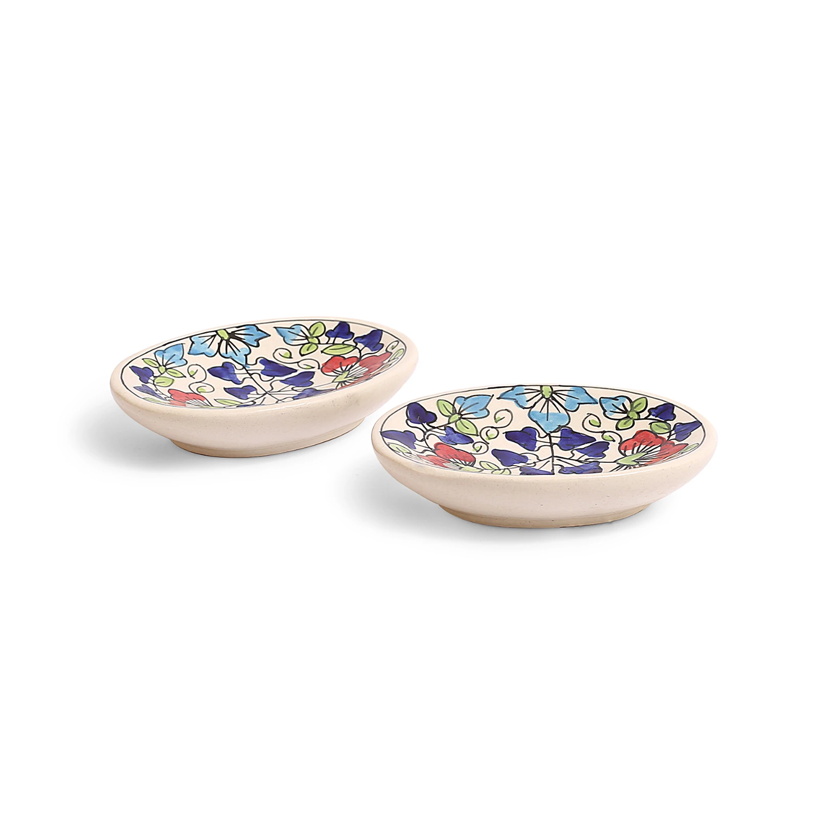 Side angle showing the shallow depth and raised base of the matching oval spoon rest pair