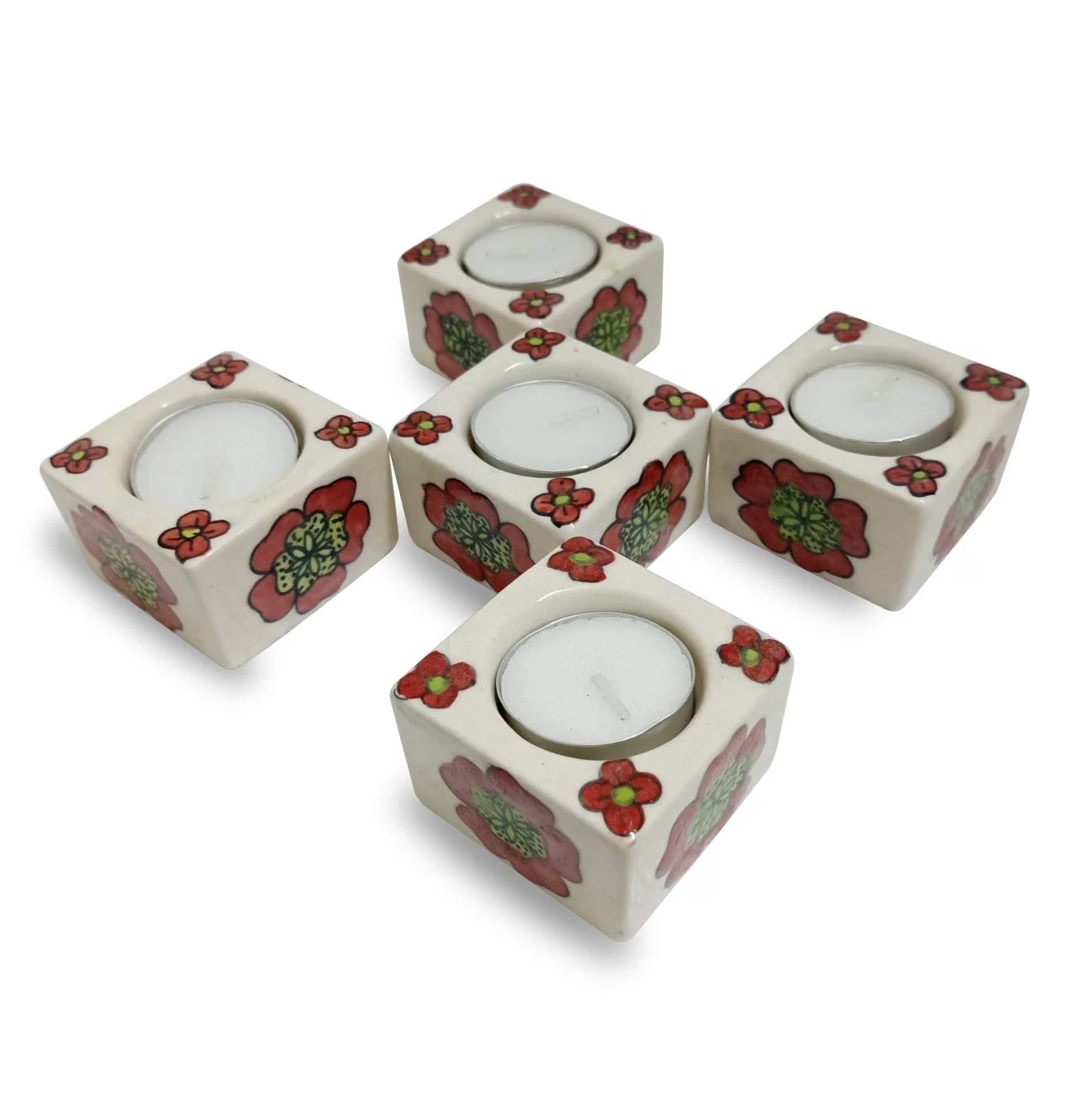 Angled group view of the floral ceramic tealight holders showing side flower patterns and top candle openings
