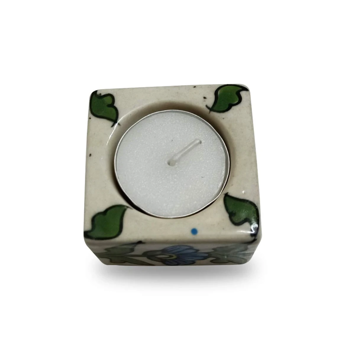 Top view of one floral candle holder showing inserted tea light in circular recess