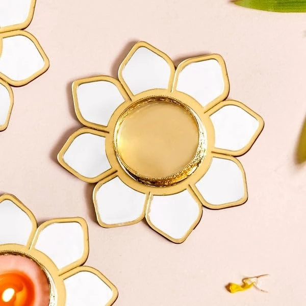 Top view close-up of the lotus holder showing mirrored petal sections and round central candle cup