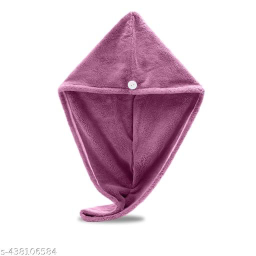Front view of mauve hair drying towel with tapered tail curled at the bottom on a plain white background
