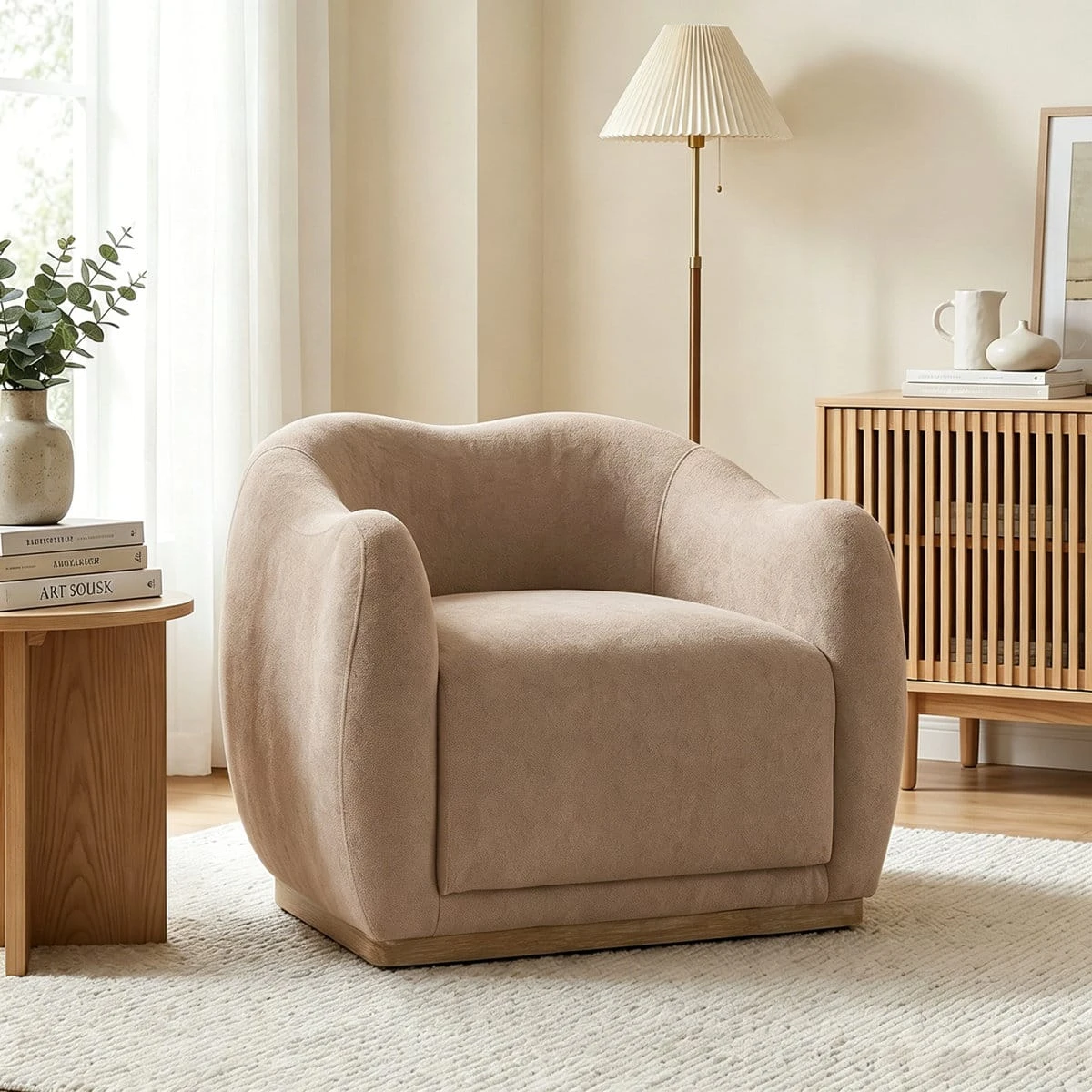 Angled view highlighting the rounded backrest, thick arms, and wide cushioned seat