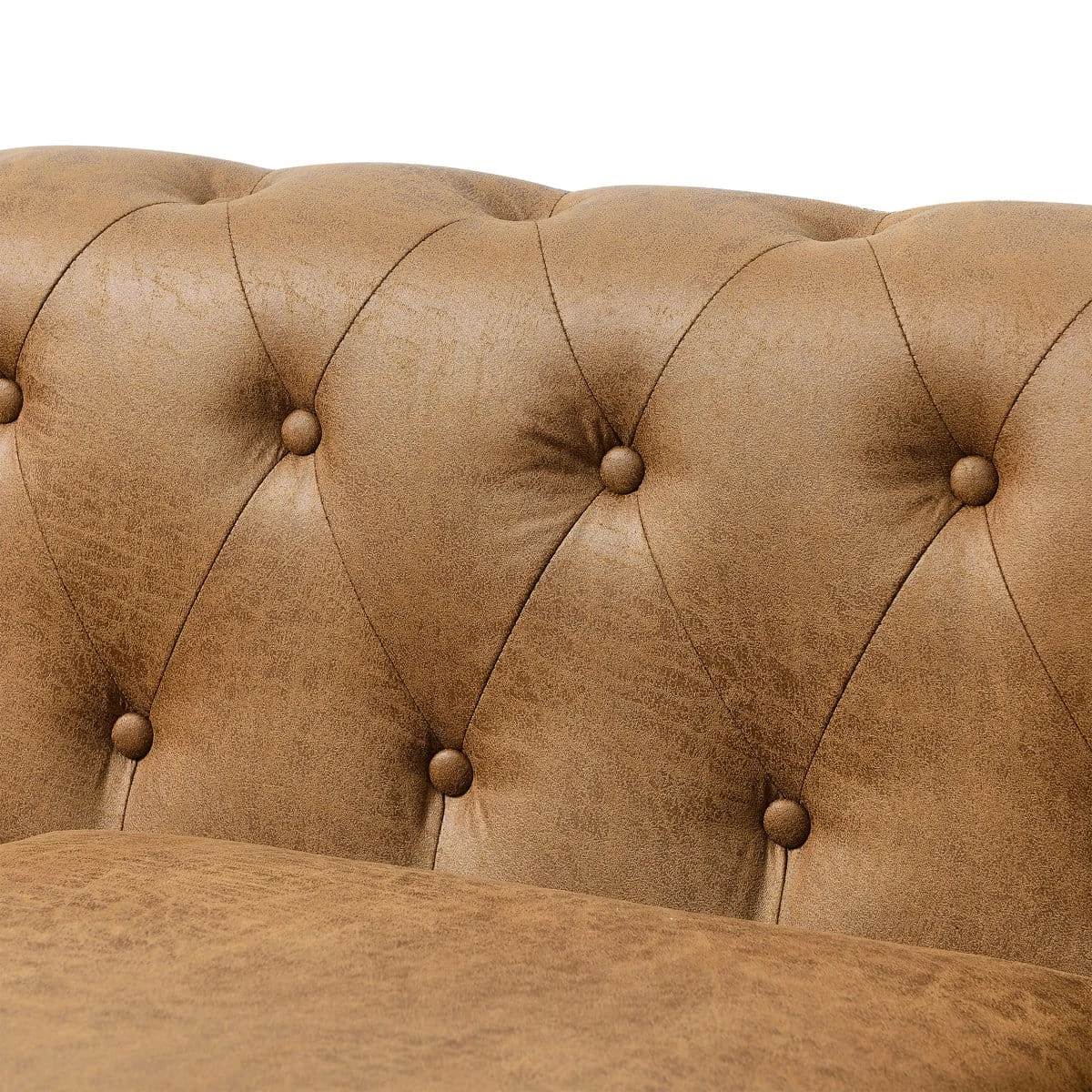 Close-up of the armchair backrest showing diamond button tufting in distressed tan brown upholstery