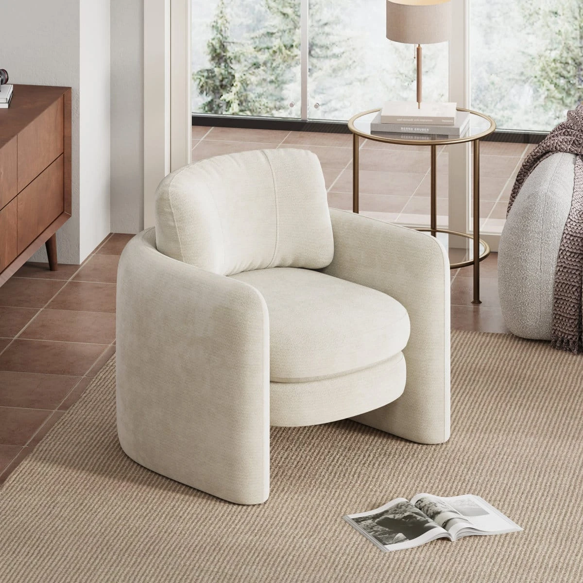 Cream upholstered accent chair with curved arms and plush seat styled in a bright modern living room