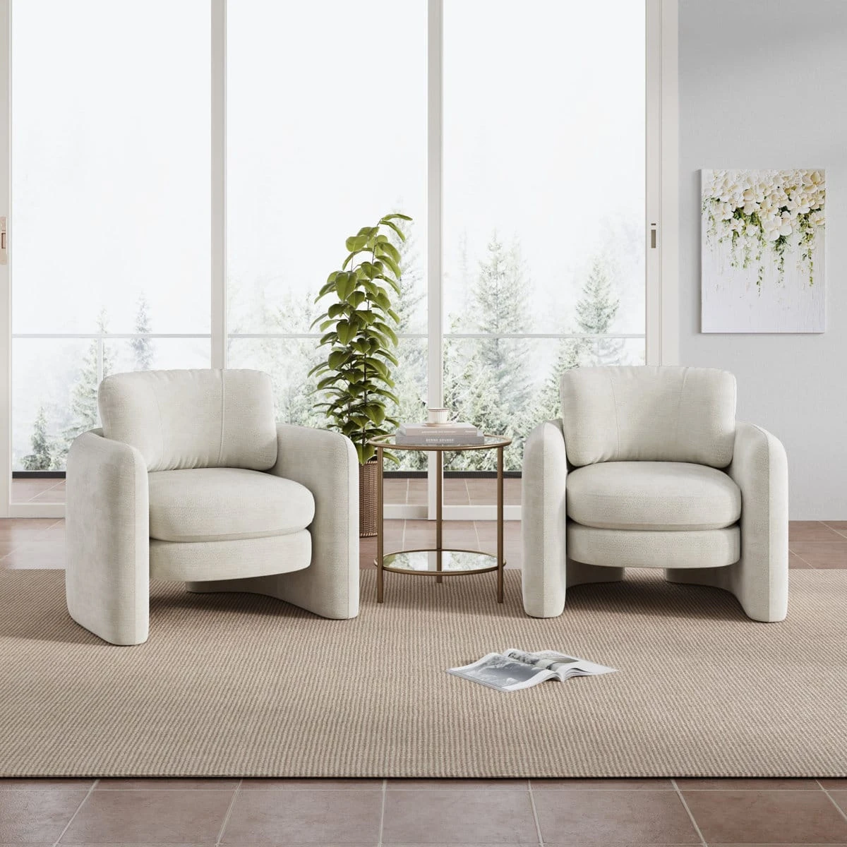 Two matching cream accent chairs shown side by side with a round side table in a staged interior