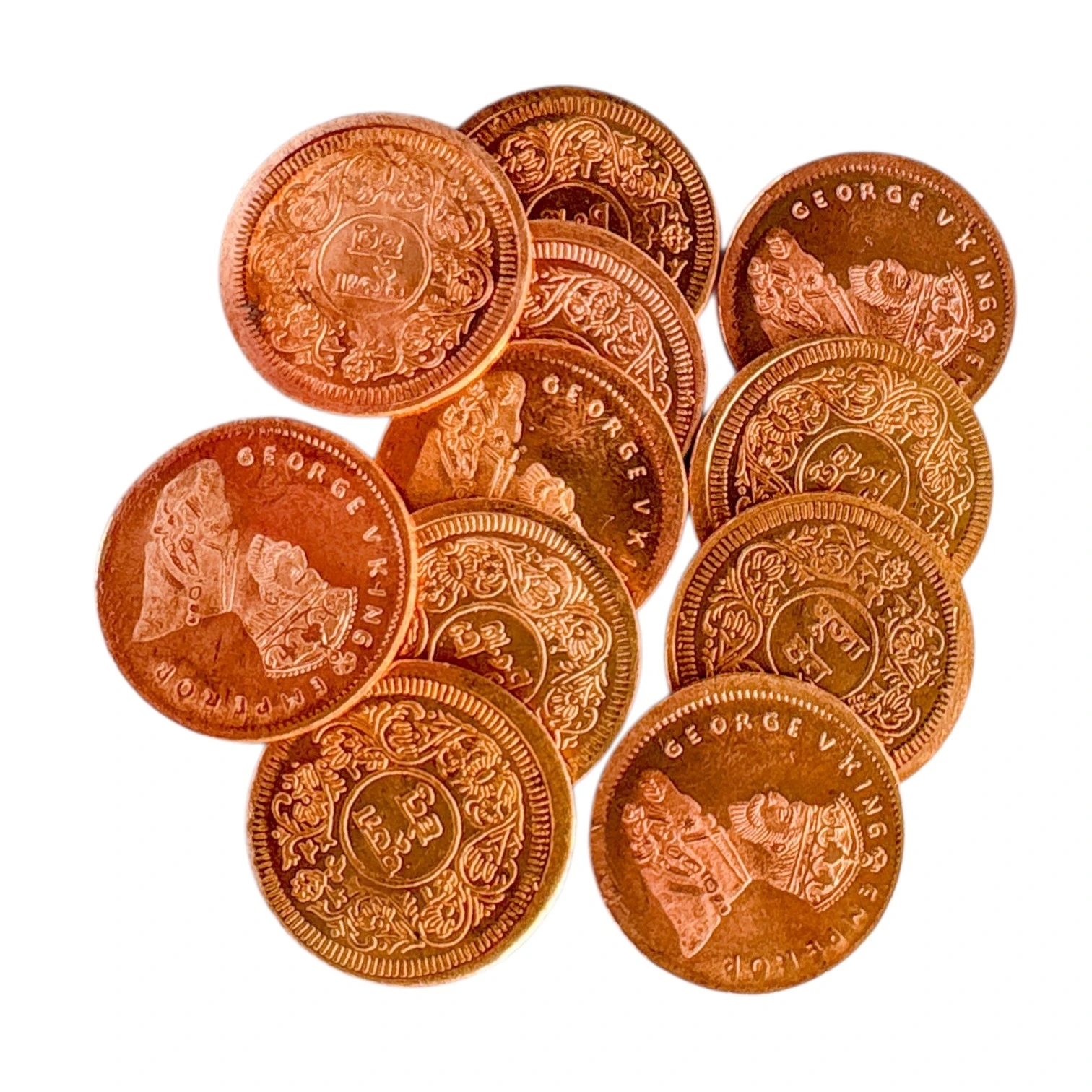 Mixed heads-and-tails view of 11 copper coins stacked loosely.