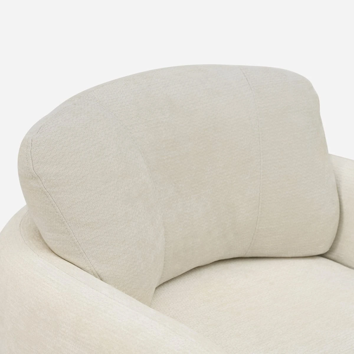 Close-up of the curved cushioned backrest in soft cream textured upholstery