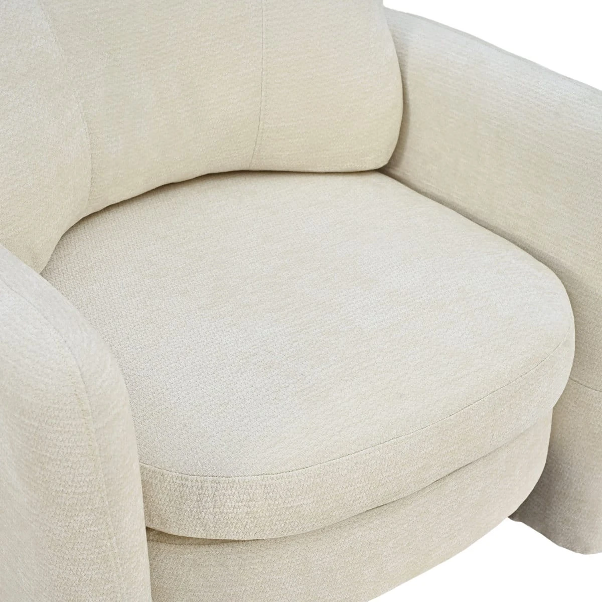 Close-up top view of the thick rounded seat cushion between curved armrests