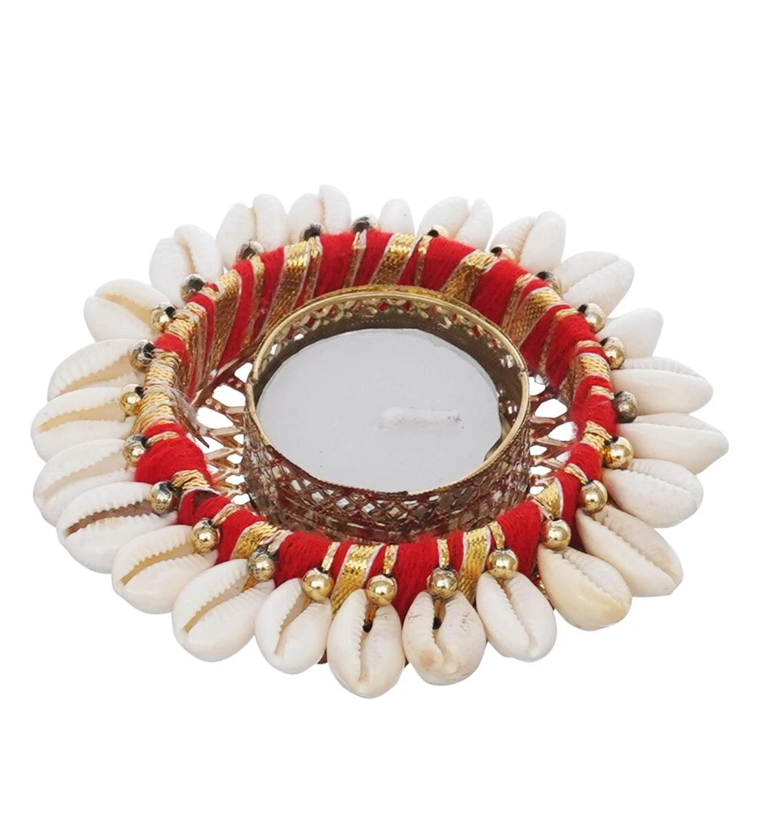 Single diya holder close-up on white background showing shell, red thread and gold bead detailing