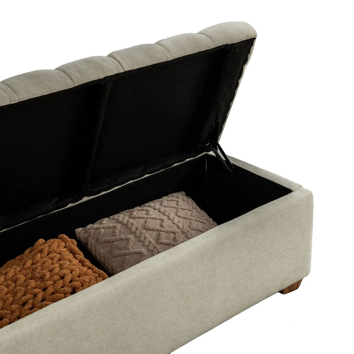 Angled close view of the open lid, interior storage box and support hinge