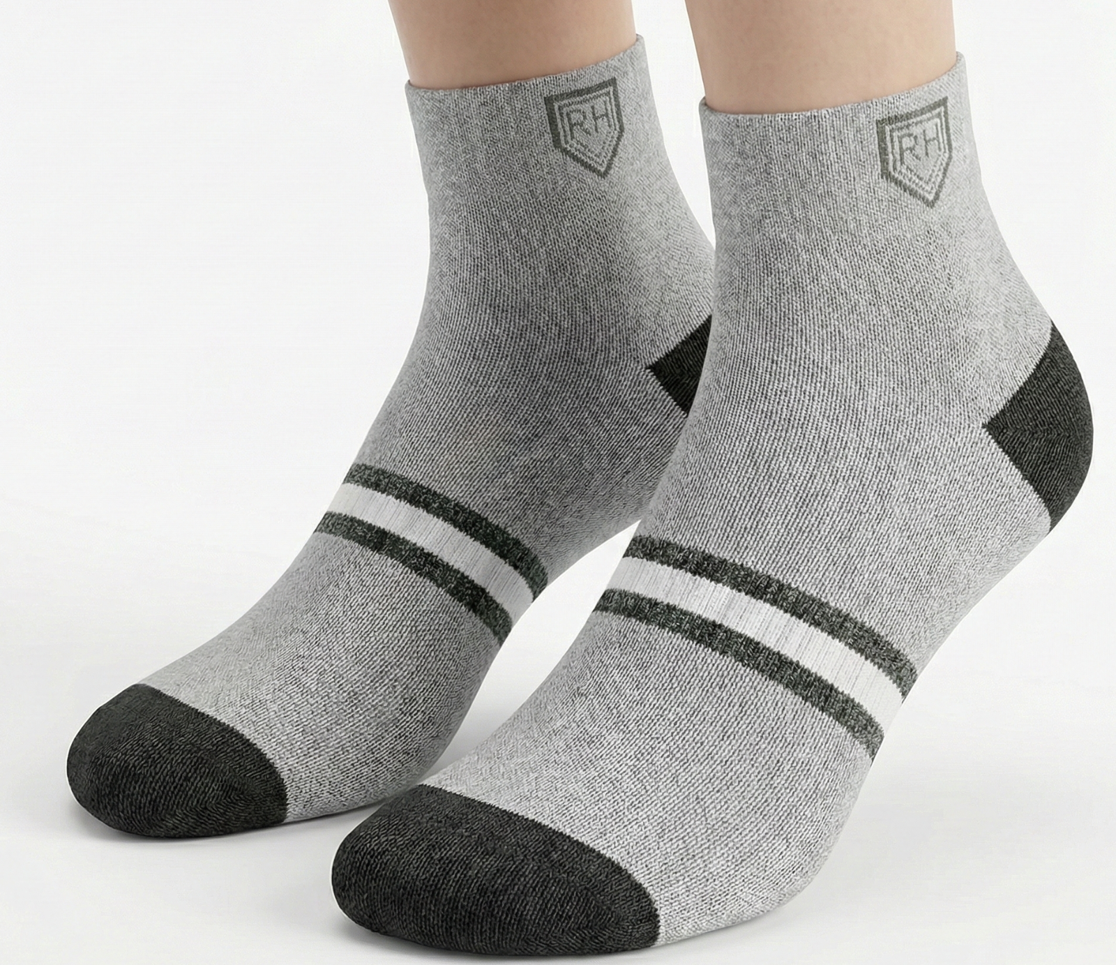 Grey ankle socks worn on feet with black toe and heel, white forefoot stripe bands and RH logo at the cuff