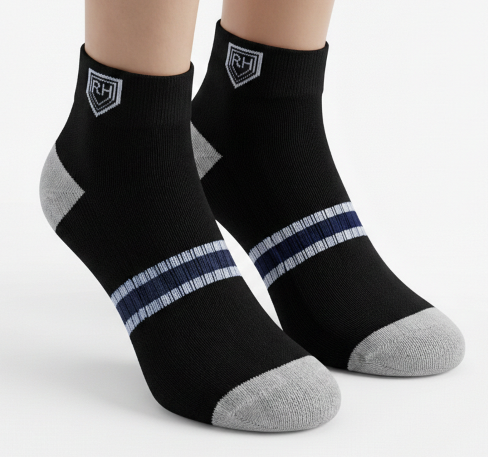 Black ankle socks worn on feet with grey toe and heel, navy midfoot band and white RH shield logo