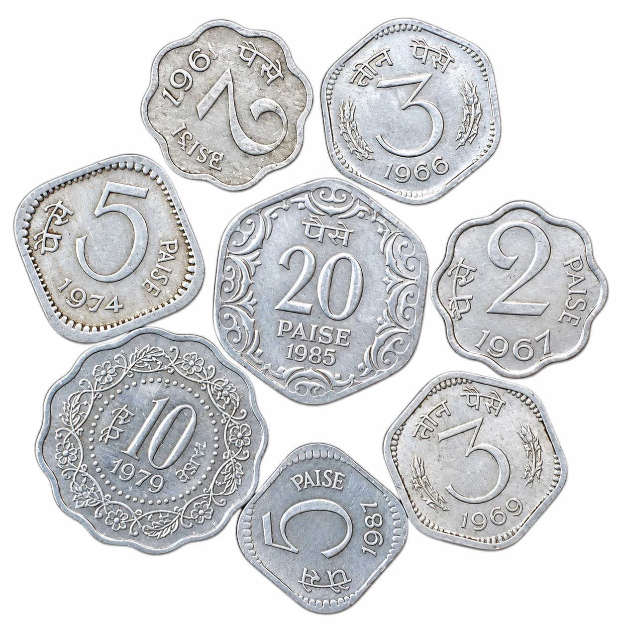 Close-up spread of eight silver-toned Indian paise coins with mixed shapes, dates, and ornate borders on white