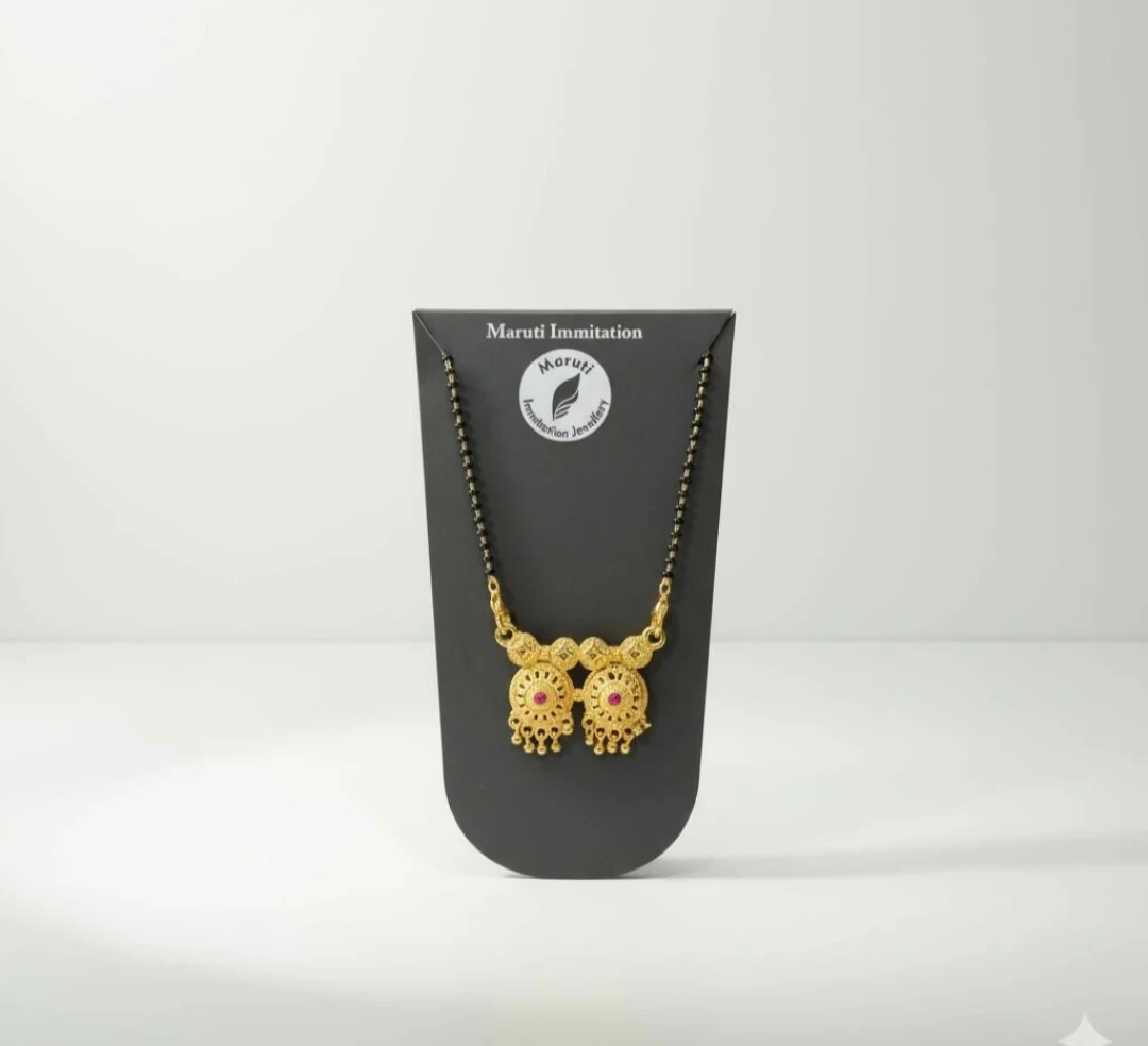 Front view of the necklace centered on a black stand over a plain white background