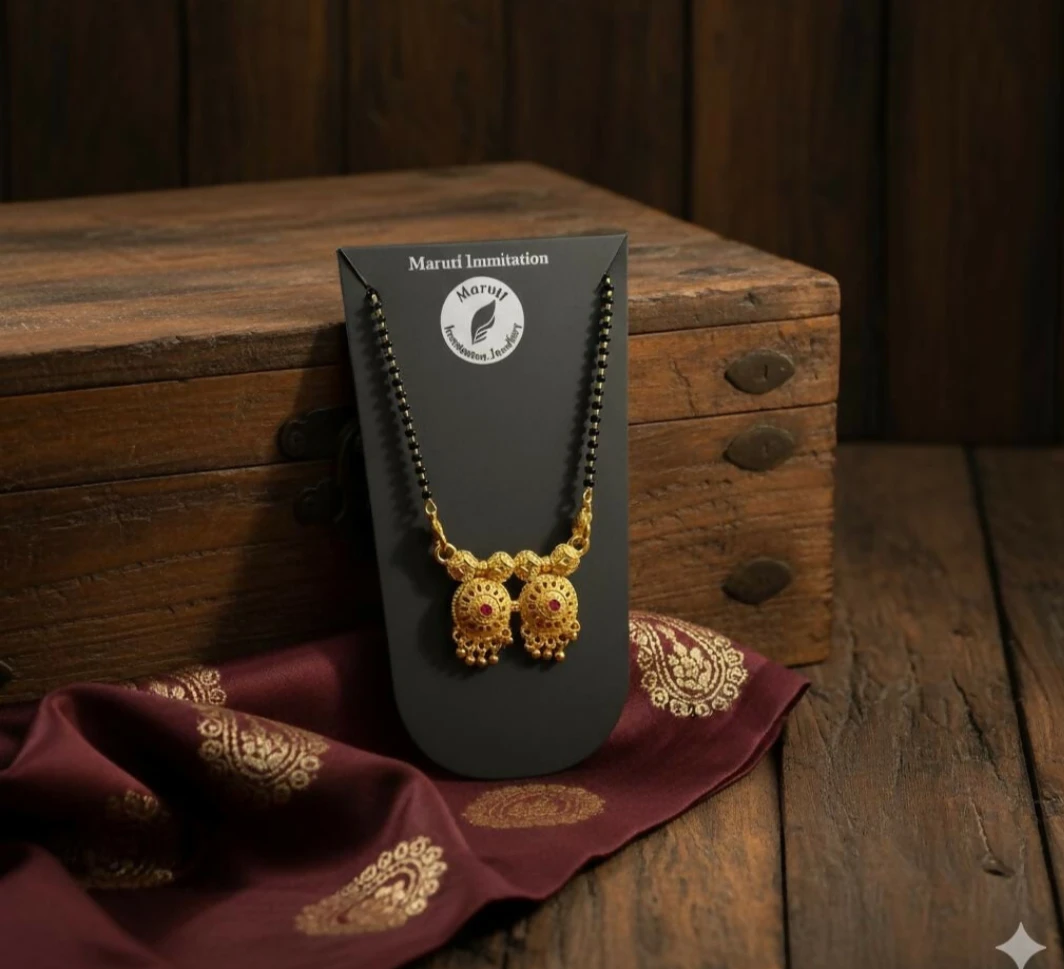 Traditional pendant necklace displayed on black card with rustic wooden box and maroon cloth styling