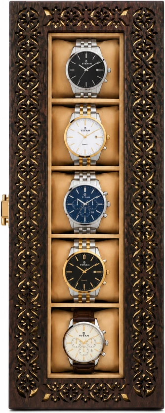 Top-down vertical view highlighting the floral carved border and five visible watches in lined compartments