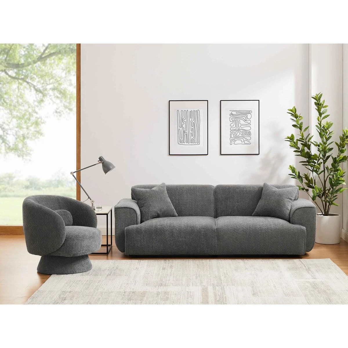 Alternate living room view of the grey sofa and matching swivel chair