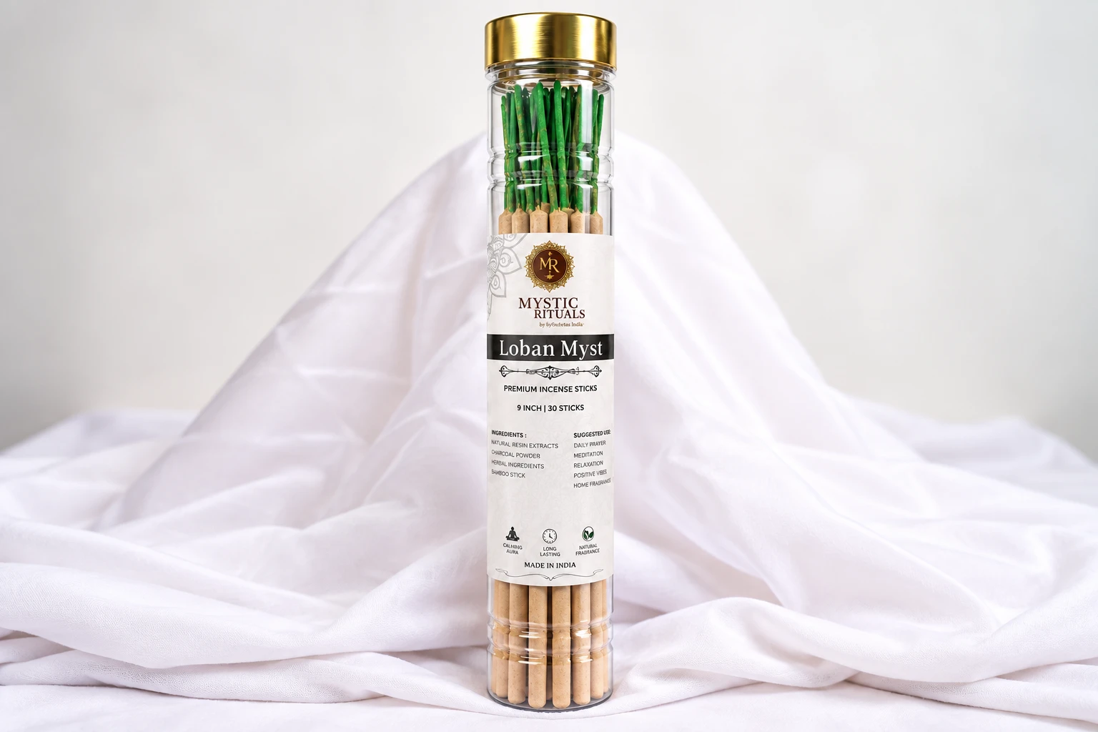 Loban Myst incense sticks tube with gold lid and white label, front view on draped white fabric