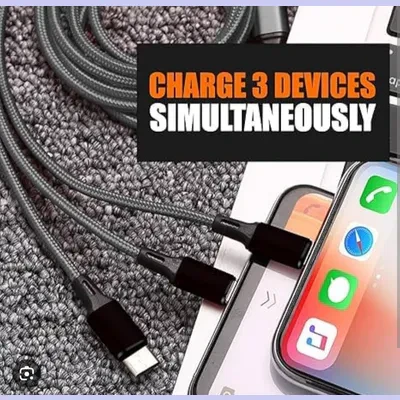 Braided multi-charging cable laid beside a smartphone with text about charging 3 devices