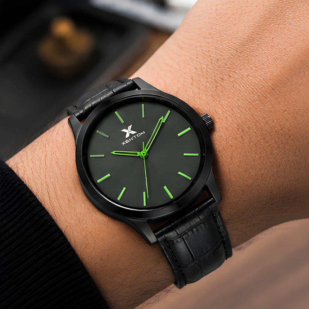 Watch worn on wrist showing the matte black round dial and bright green hands in real use