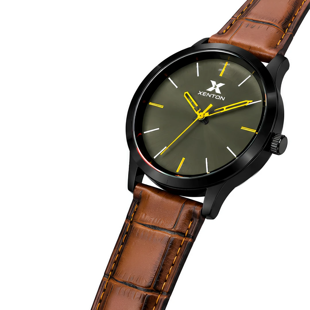 Angled view highlighting the black bezel, olive dial and yellow hands with brown stitched strap