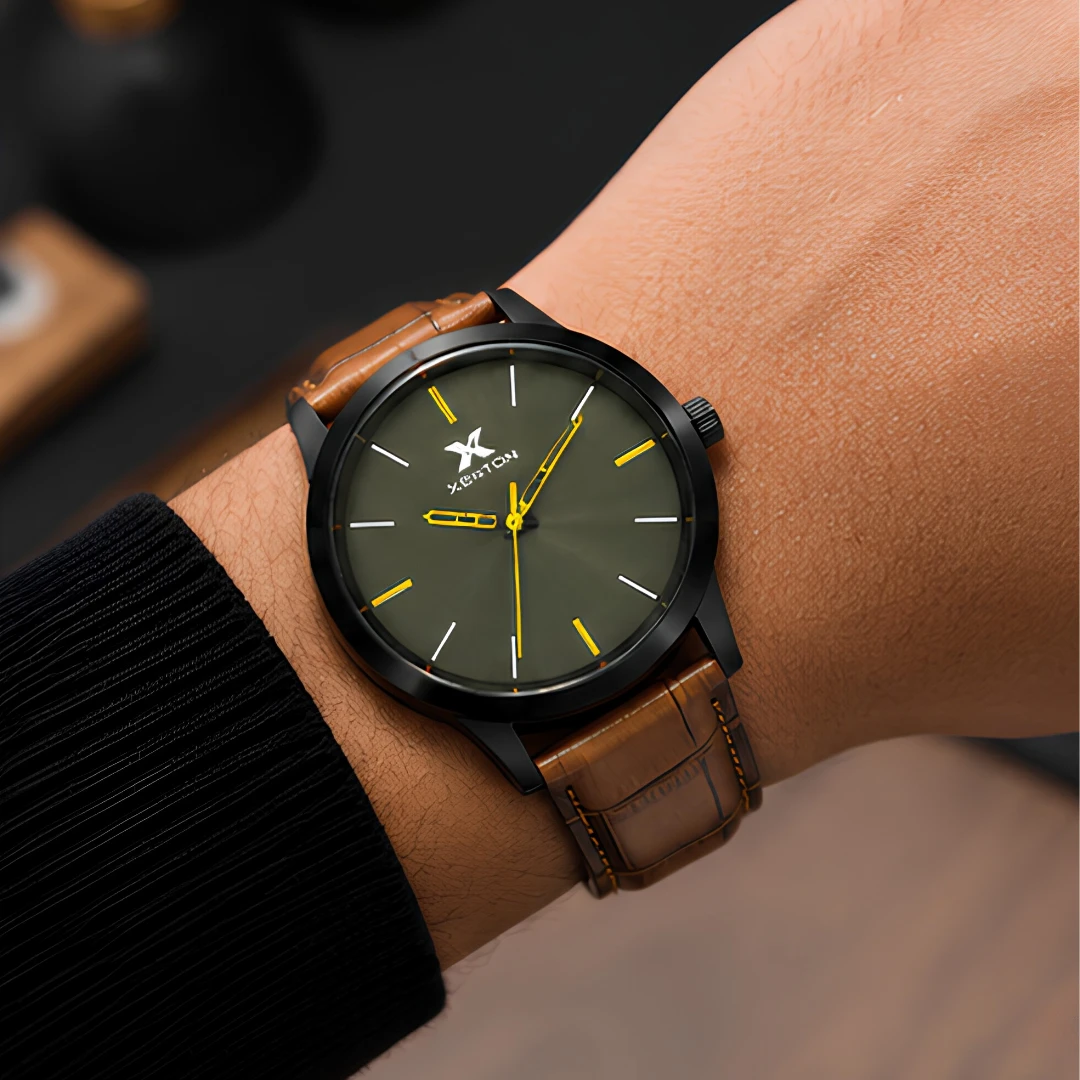 Watch worn on wrist showing slim black case and brown crocodile-textured leather strap