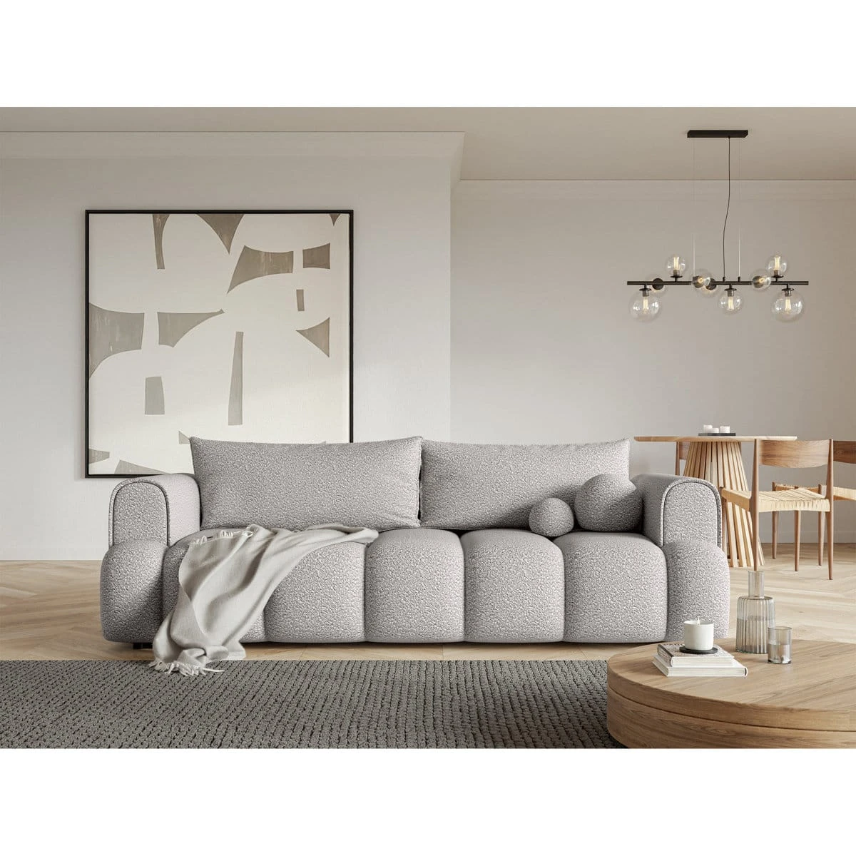 Front view of the sofa styled in a living room with a throw and round accent cushions