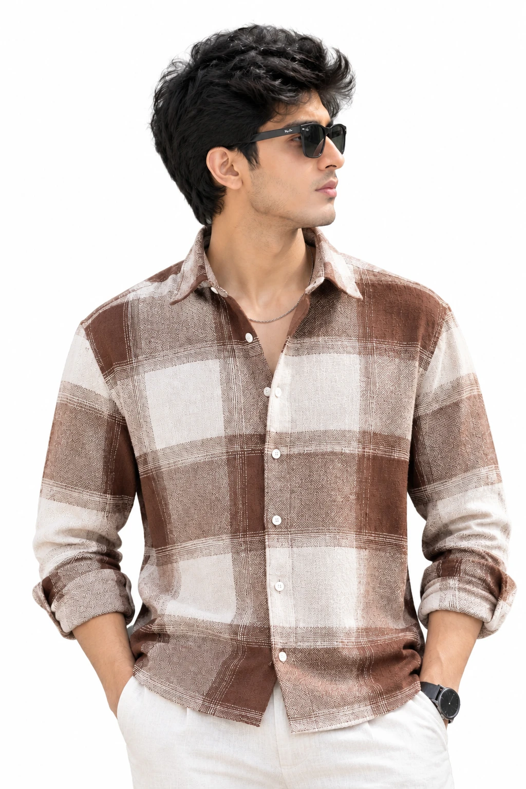 Studio front view of the brown checked shirt styled with rolled sleeves