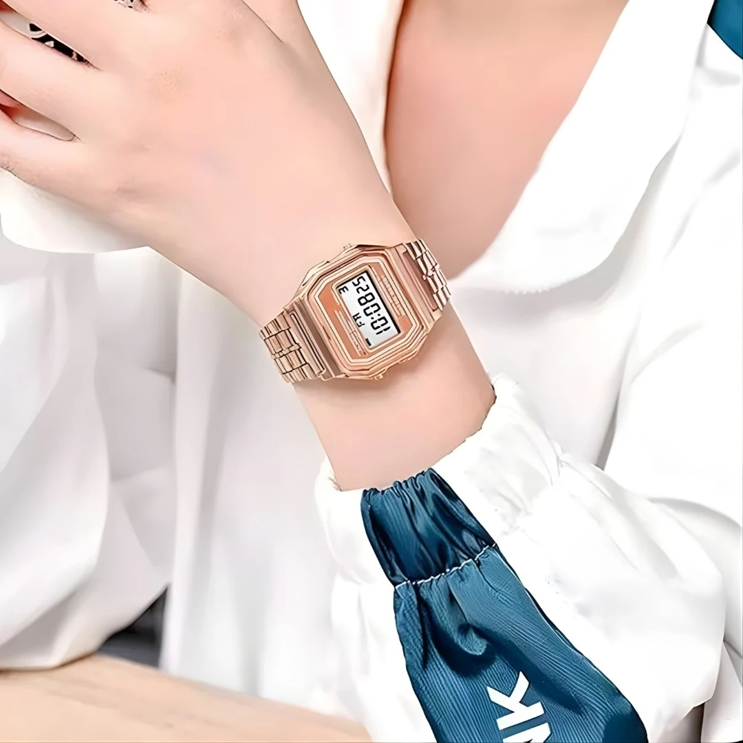 Rose gold digital watch worn on the wrist, showing real-life fit and compact square case size
