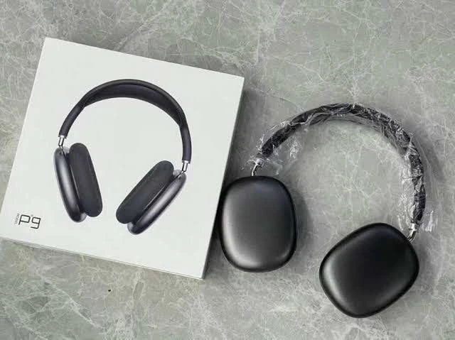 P9 headphone set beside white product box, with protective plastic on the headband