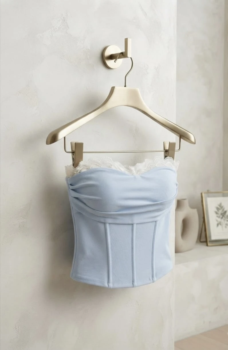 Sky blue lace trim strapless corset tube top displayed on hanger