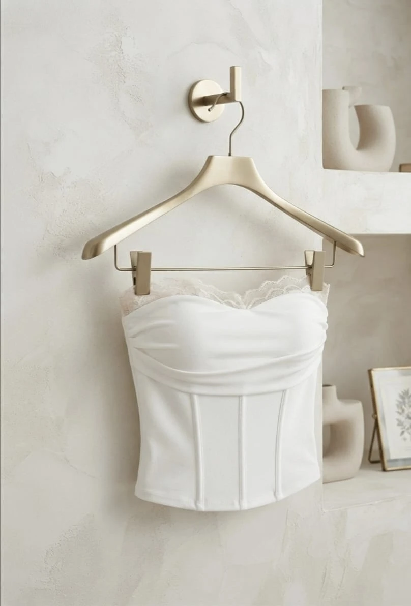 White lace trim strapless corset tube top displayed on hanger
