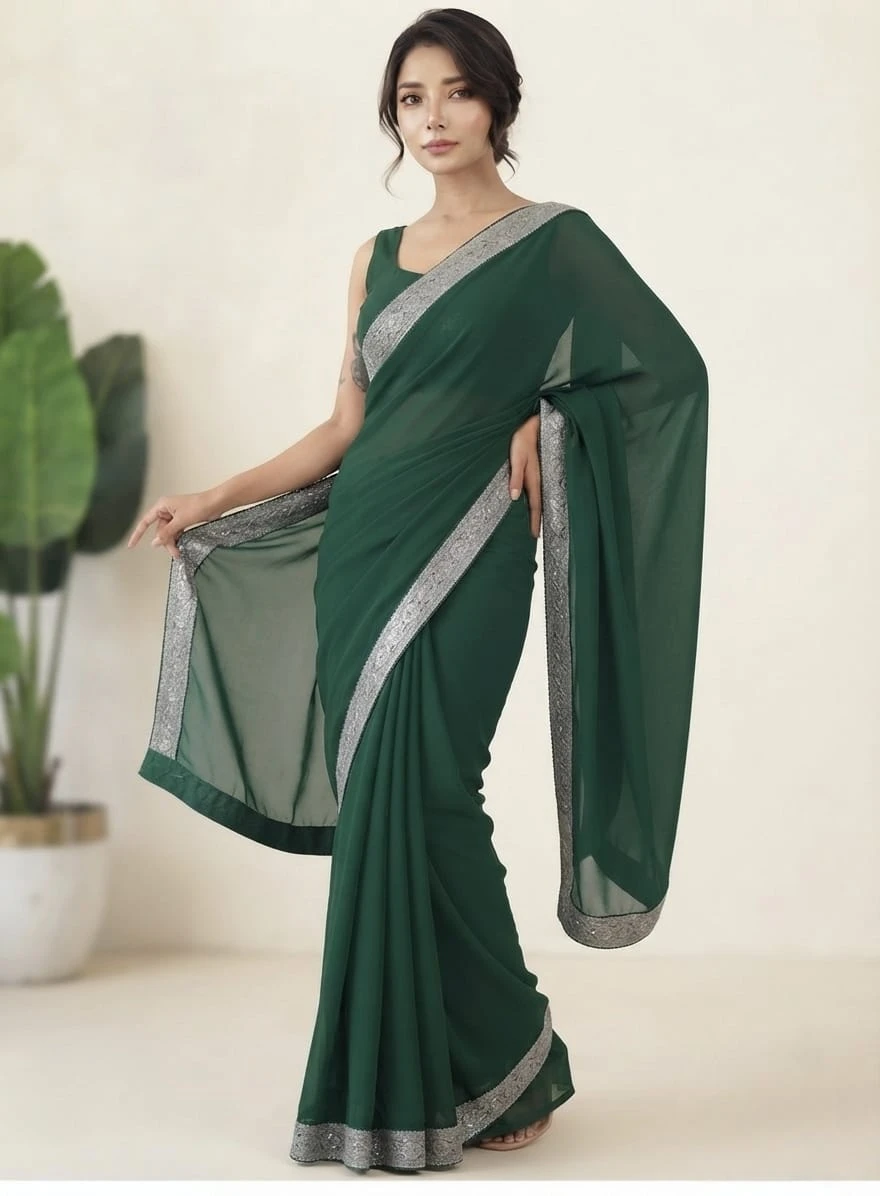 Full-length side view of green saree showing drape and silver border